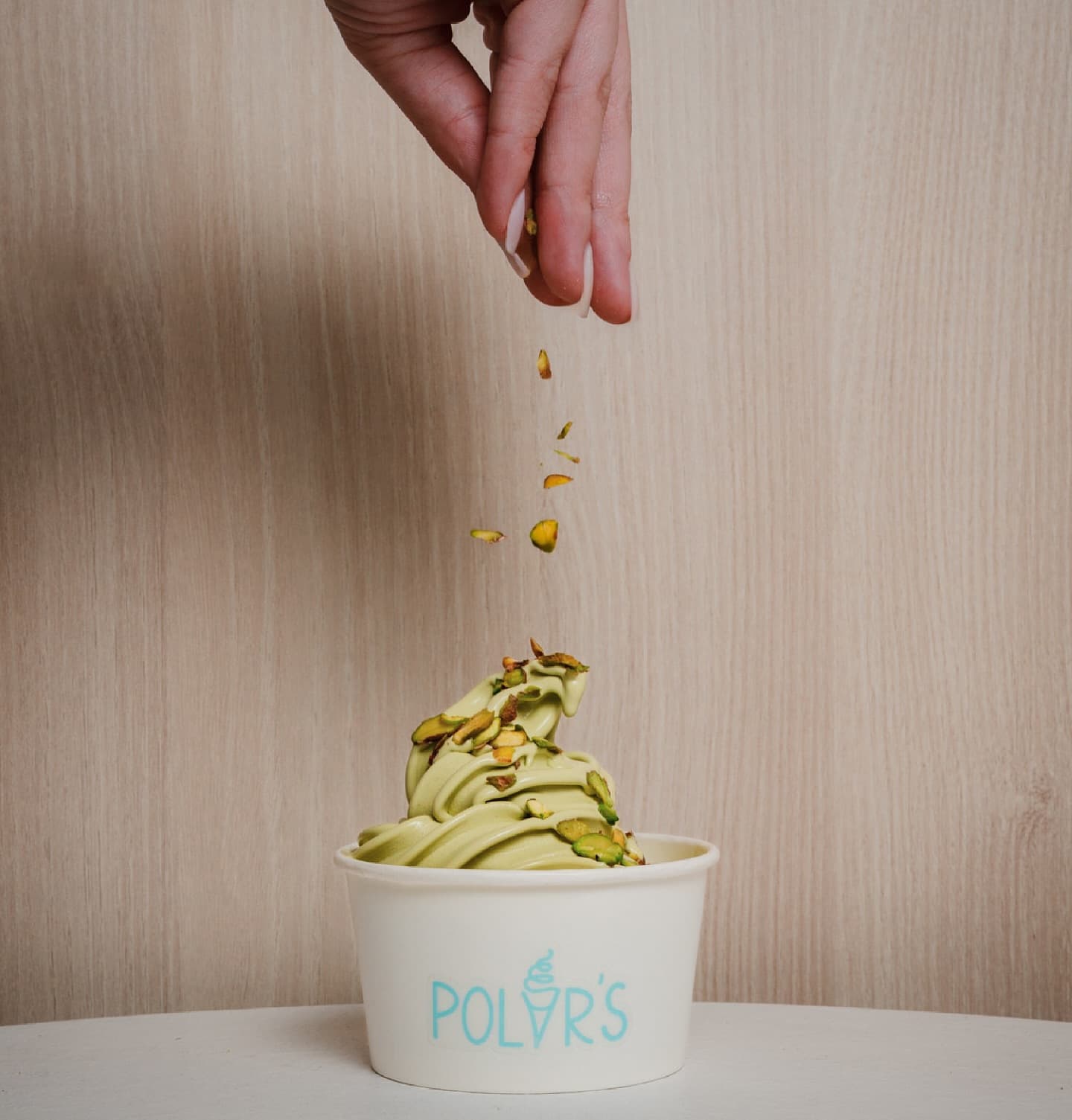 Hand throwing pistachio